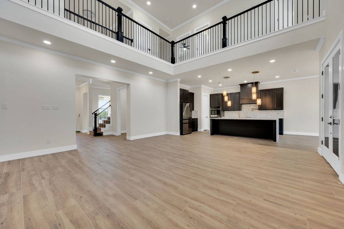 Two-story living room open to the kitchen