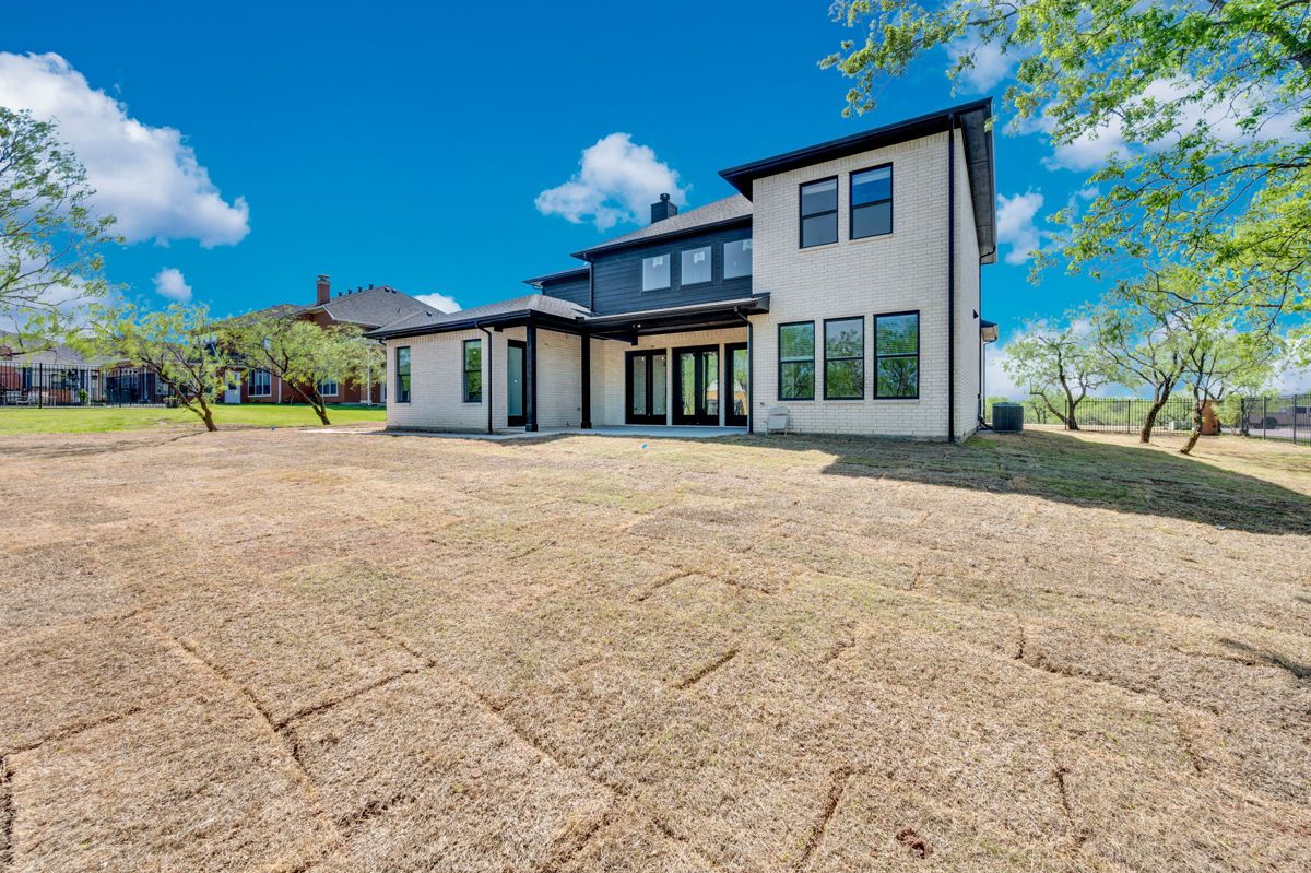 Rear of the home on a wooded lot